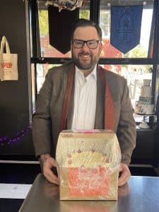 A groom picking up his wedding cake from Whipped Bakeshop in Philadelphia